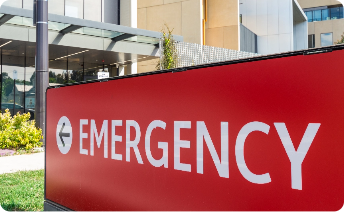 Red emergency sign outside a hospital.